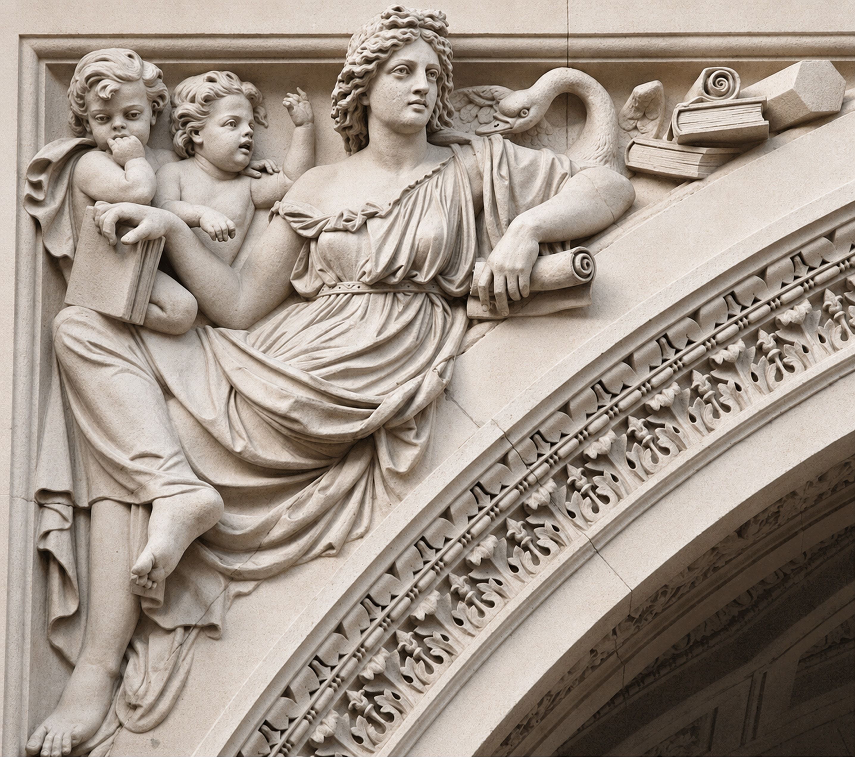 Classical bas-relief of figures with books and a swan